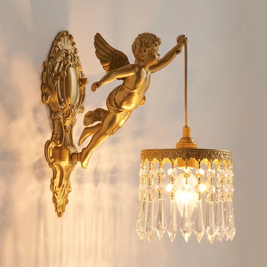 An antique vintage French wall sconce with a brass glass construction featuring a curved glass light and angelic figures.