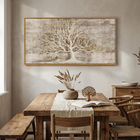 Dining room with wooden table, chairs, and a large framed tree artwork on the wall.