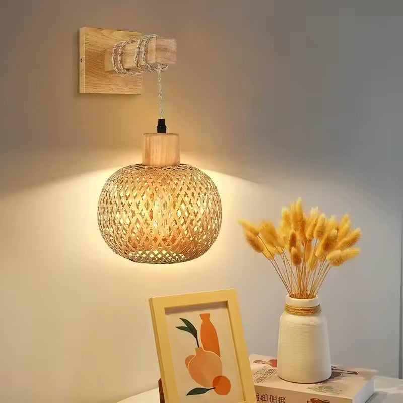 Bamboo Woven Rattan Wall Lamp casting a warm glow on a neutral wall
