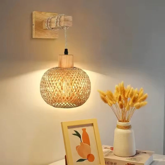Bamboo Woven Rattan Wall Lamp casting a warm glow on a neutral wall
