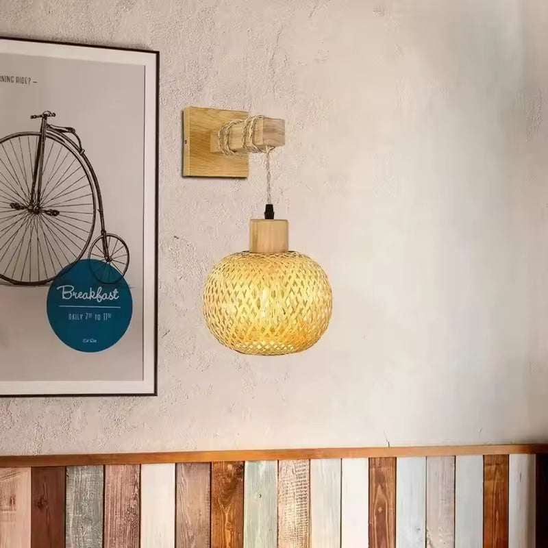 Bamboo rattan wall sconce illuminating a cozy bedroom corner