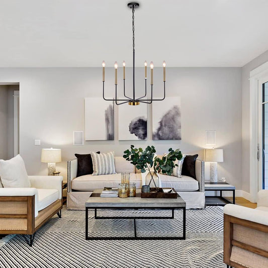 Modern living room with a chandelier, sofa, coffee table, and decorative elements.