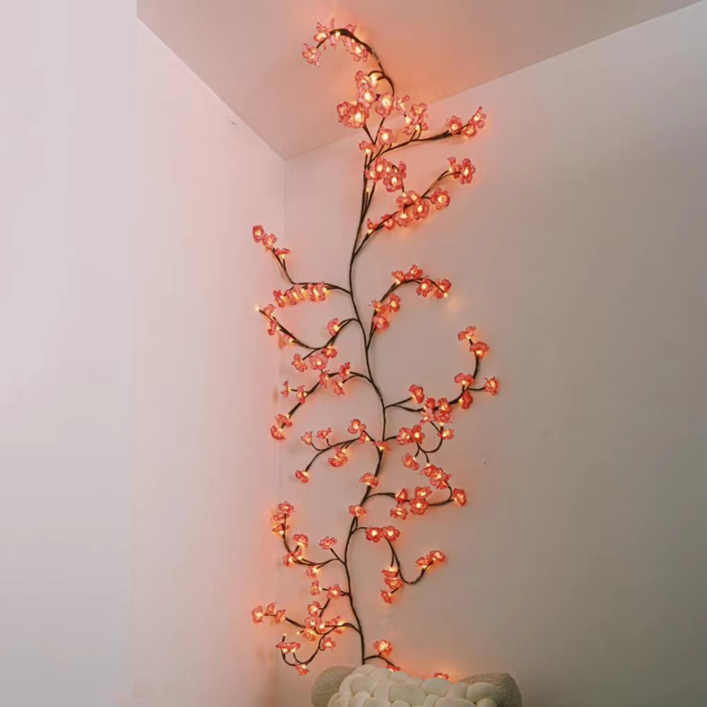 Cherry Blossom Branch Shaped LED Lights on wall a above sofa and goes up to the ceiling