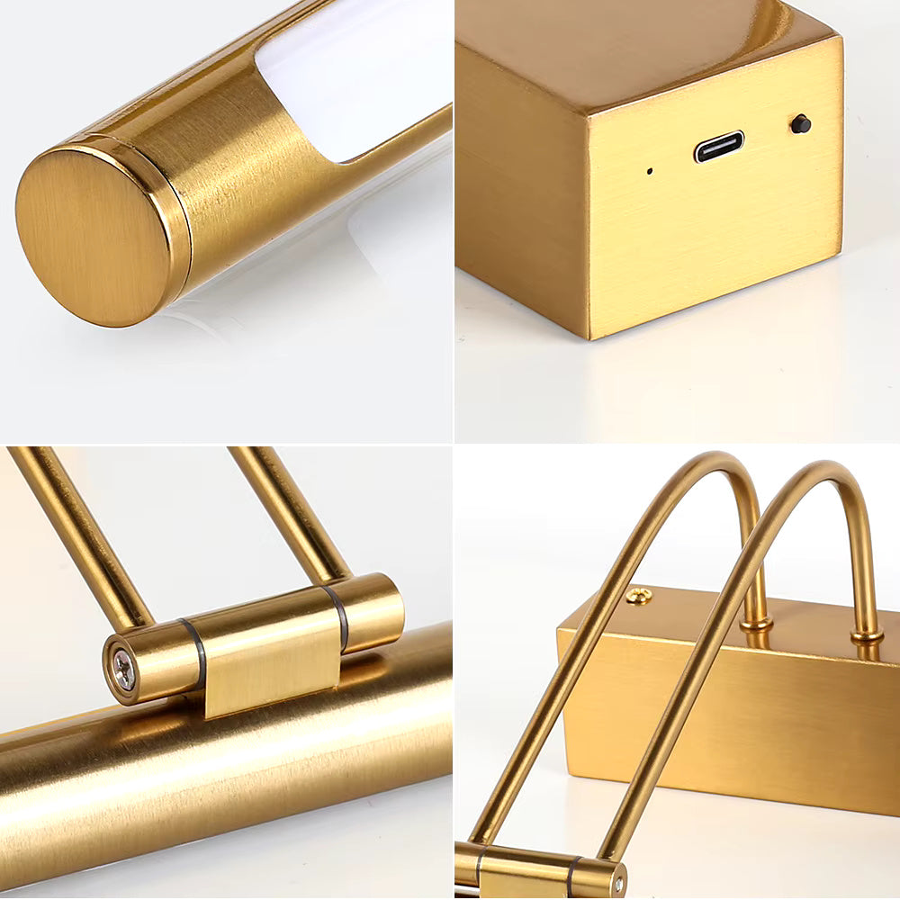 Close-up of brass picture light showing adjustable lamp head and wall-mount bracket in detail