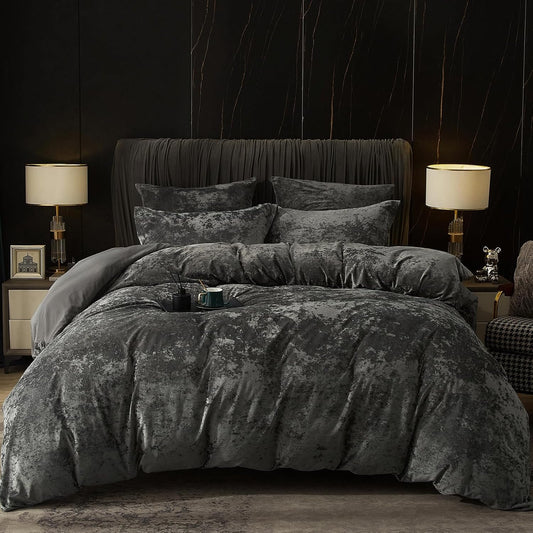 Dark gray textured bedding set on a bed in a dimly lit bedroom.