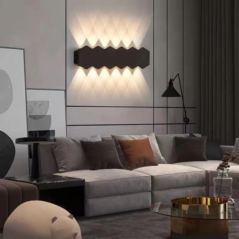 A well-lit outdoor wall featuring the Trilight Glow LED Wall Sconce with six lights.