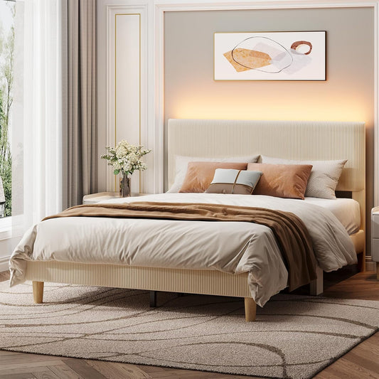 Neatly made bed with beige bedding and pillows in a bedroom setting.
