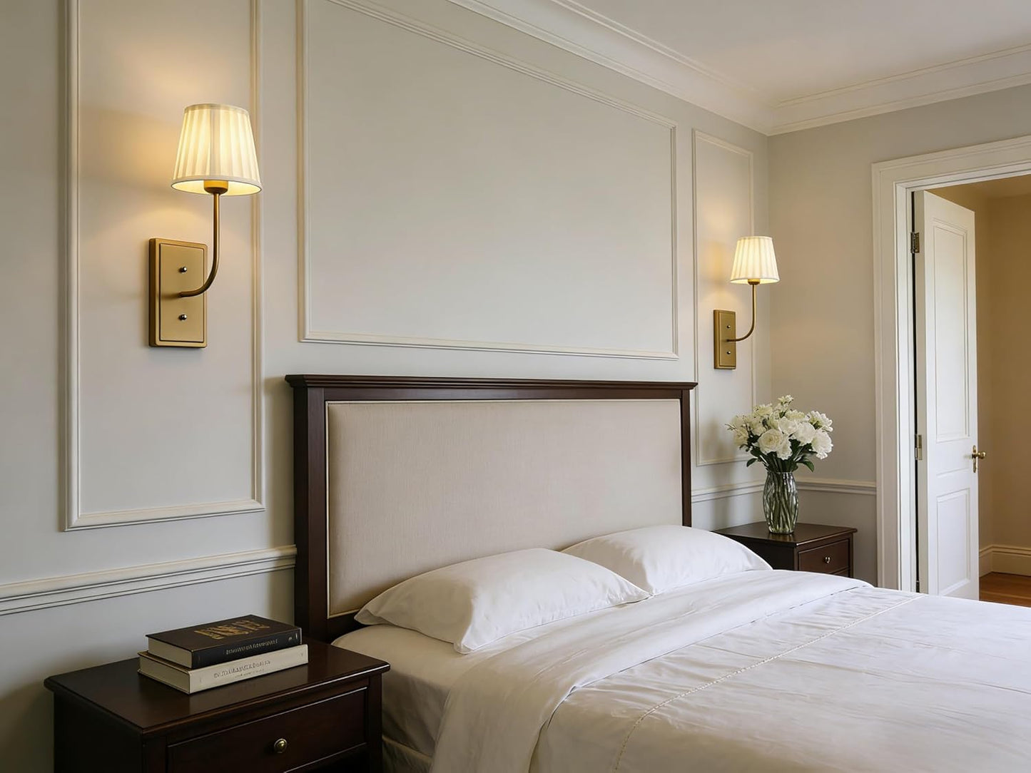 Neatly made bed with white bedding in a bedroom setting.
