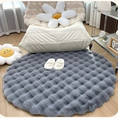 Transform your living space into a cozy winter retreat with this round rug featuring white fur, reminiscent of a snowy soft faux rabbit's texture.