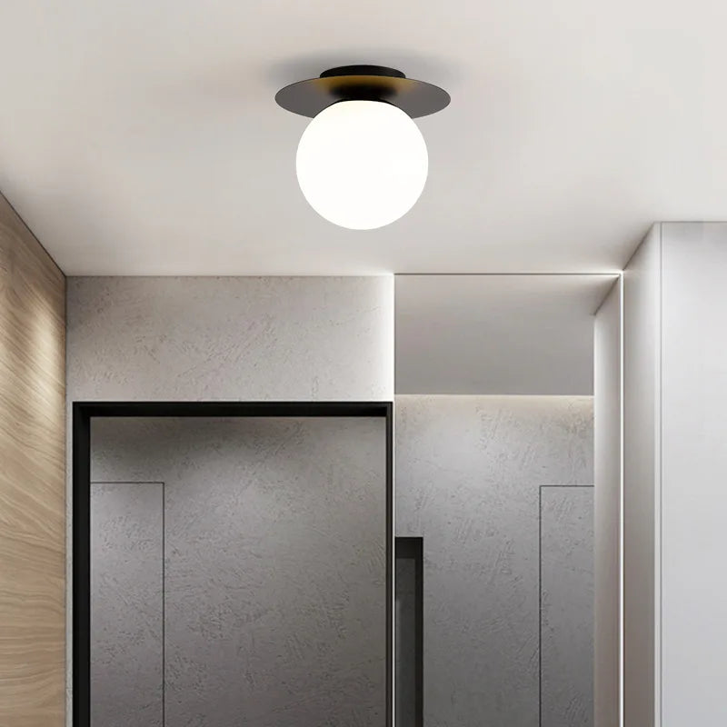 Elegant white and black light fixtures adorning ceiling, showcasing the Luminova White Glow Ceiling Lamp.