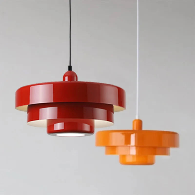 Pendant lights in a dining room: two exquisite Amber Aura fixtures suspended from the ceiling.