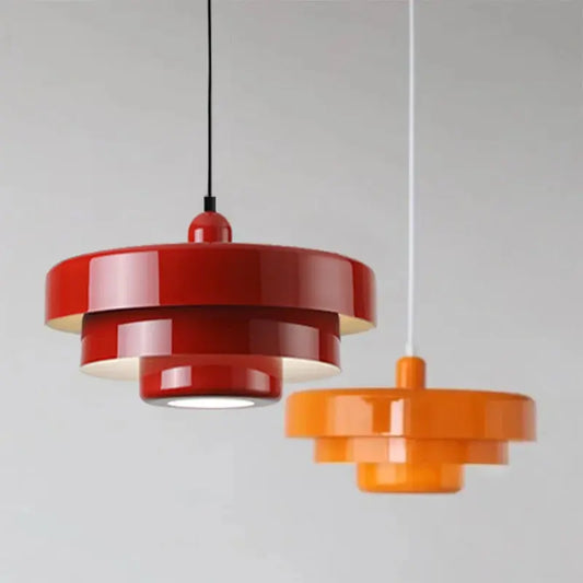 Pendant lights in a dining room: two exquisite Amber Aura fixtures suspended from the ceiling.