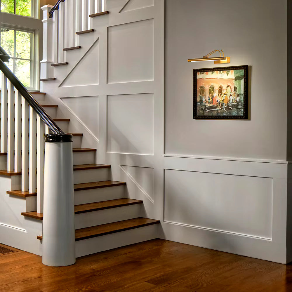 Side profile of 40 cm battery-powered brass artwork light highlighting its slim aluminum arm