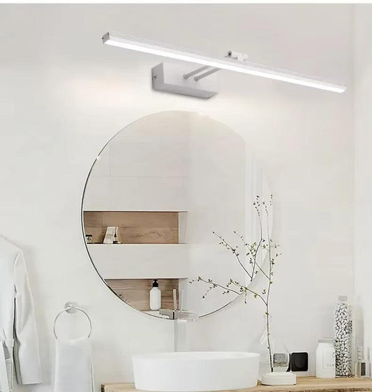 Side view of aesthetic wall sconce but in white color body showing brass arm and frosted glass shade over white vanity