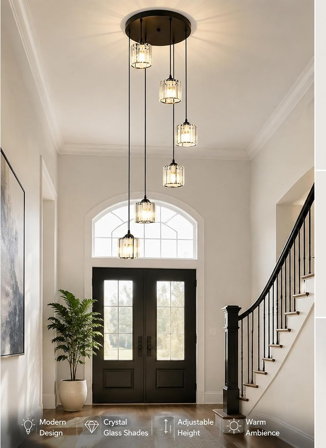 Foyer with modern pendant lights, staircase, and double doors.