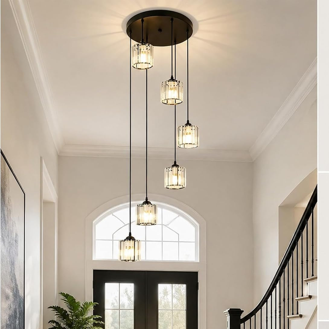 Foyer with modern pendant lights, staircase, and double doors.