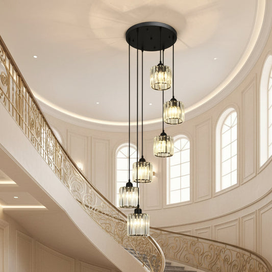 Modern staircase with decorative pendant lights and a wall feature.