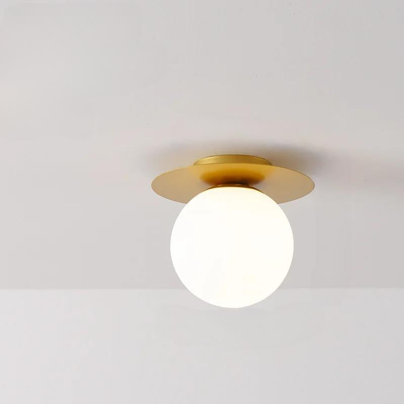 Transform your wall into a captivating display with white and gold light fixtures, showcasing the Luminova White Glow Ceiling Lamp.