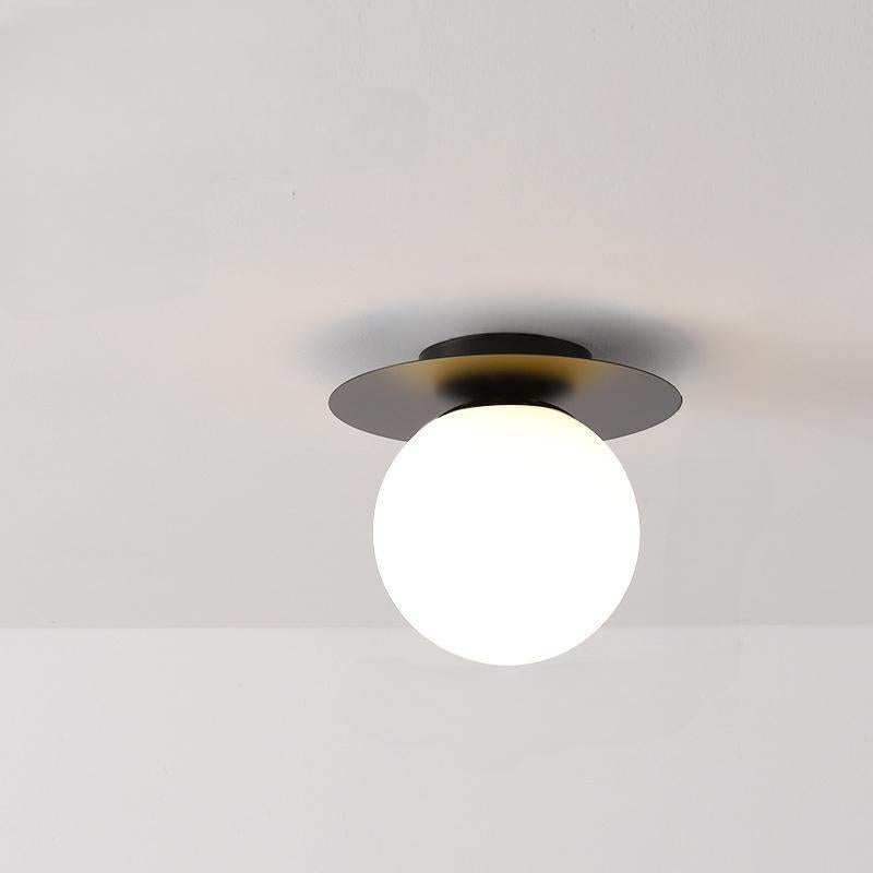 Enhance your space with these exquisite white and black light fixtures, highlighting the Luminova White Glow Ceiling Lamp.