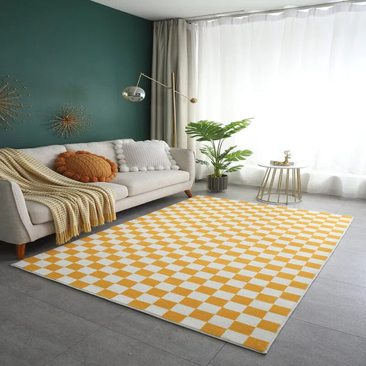 yellow and white checkered rug on floor in living room under sofa