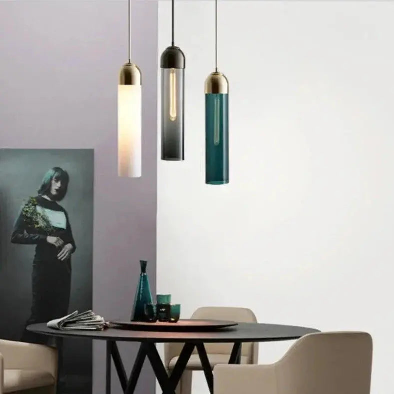 multi color glass pendant lights over coffee table