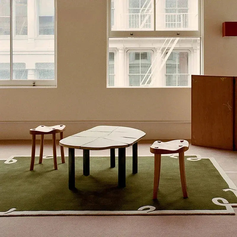 Green retro area rugs under small tables