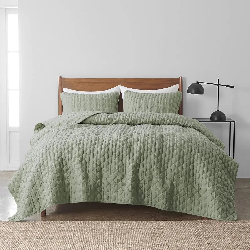 Sage green quilts & comforter set on wooden bed  for cozy summer vibes
