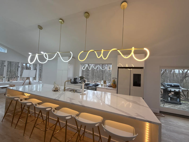 Black modern linear chandelier over dining table 