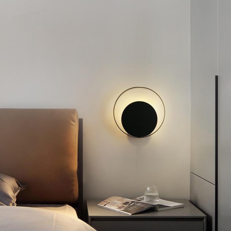 unique ring and black circle wall sconce on bedside
