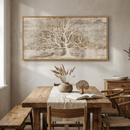 Dining room with wooden table, chairs, and a large framed tree artwork on the wall.