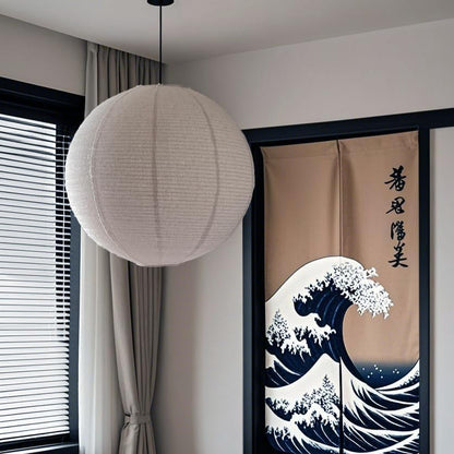 Modern interior with a lamp, curtains, and a decorative screen with wave design.