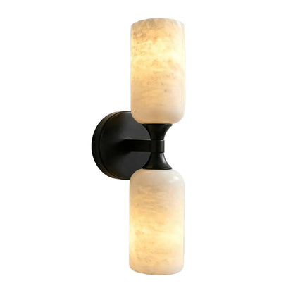 Wall-mounted light fixture with two glass shades on a plain background
