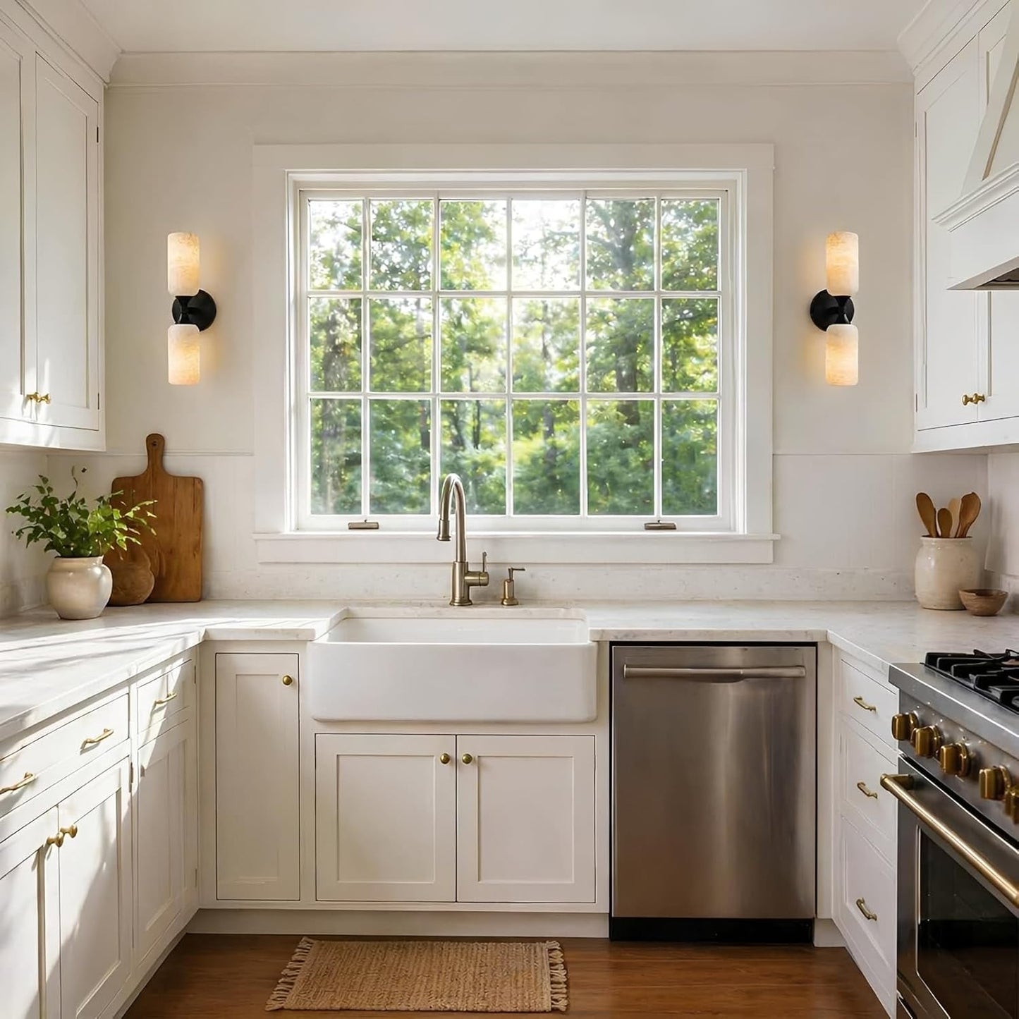 Modern kitchen with white cabinets, stainless steel appliances, and a window view of greenery.