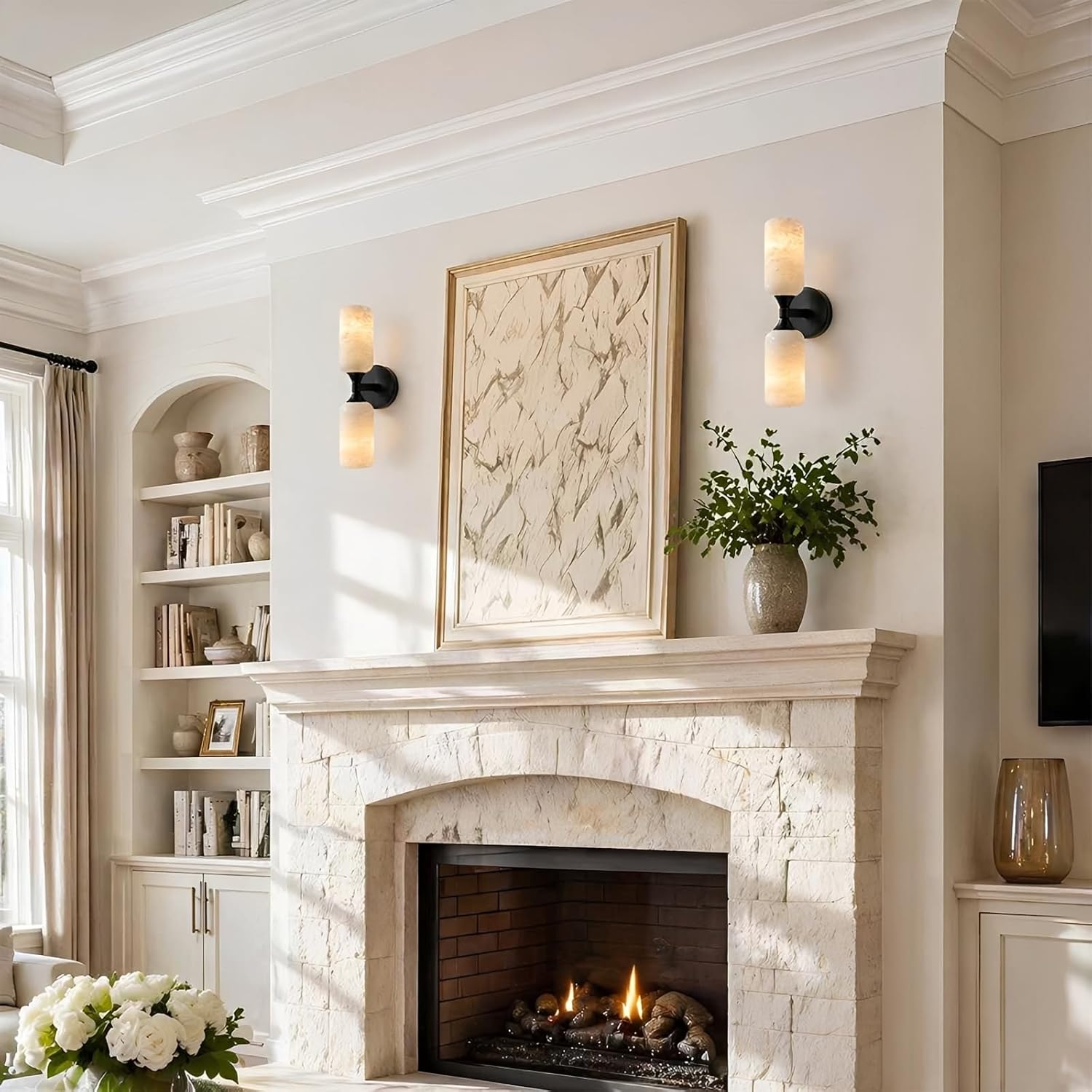 Living room with a fireplace, bookshelf, and decorative elements.