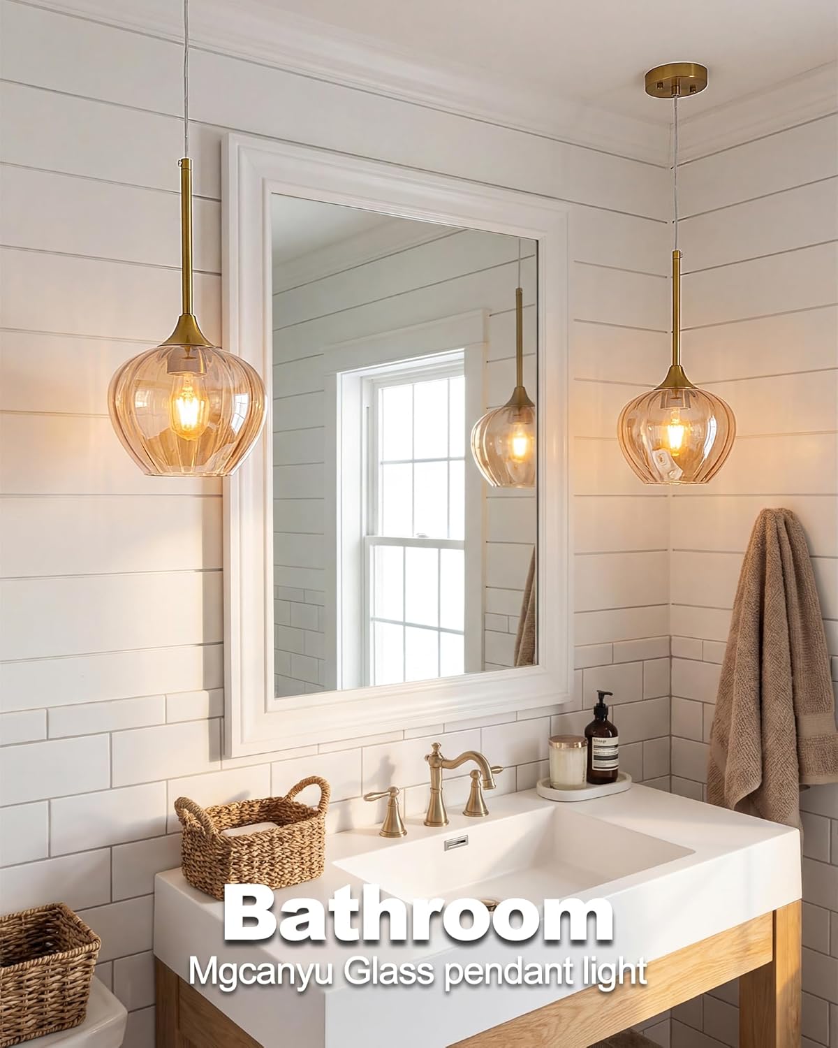 Bathroom with a sink, mirror, and glass pendant lights.