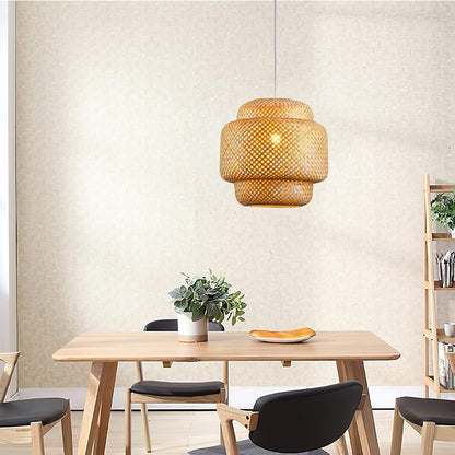Dining room with wooden table, chairs, and a woven pendant light.