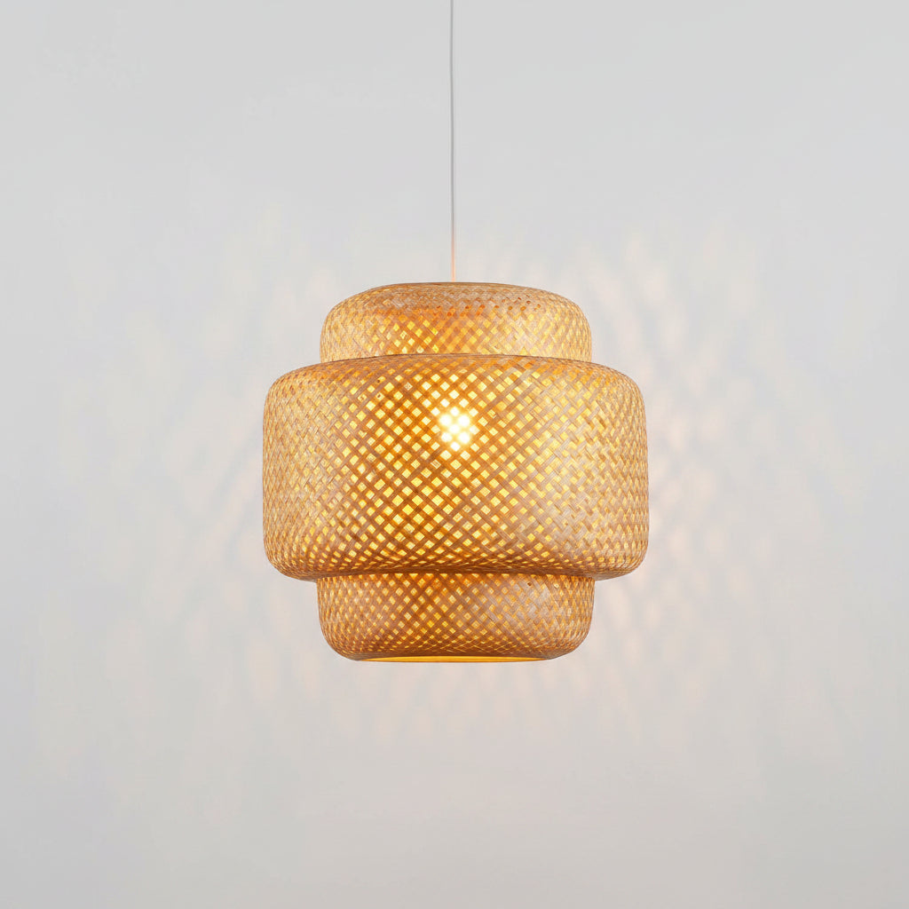 Woven pendant light with a warm glow against a neutral background