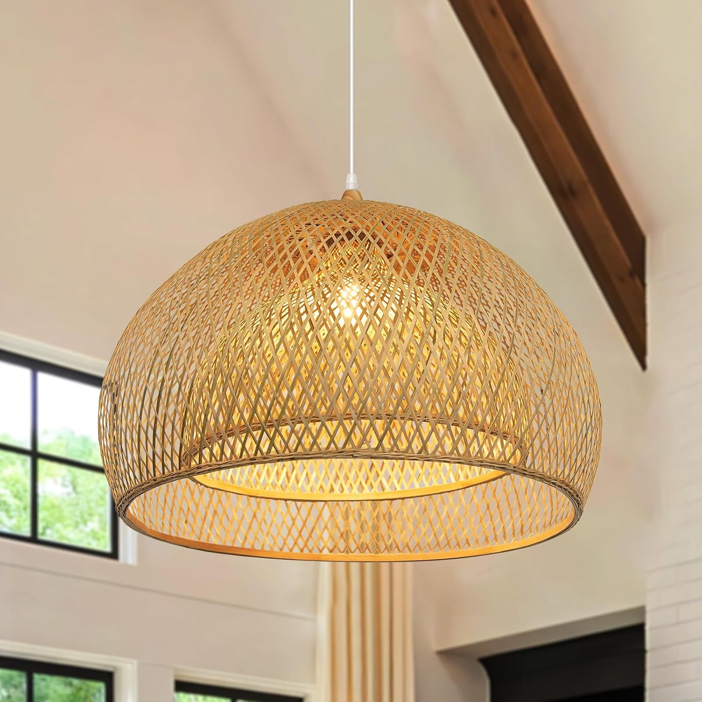 Woven pendant light hanging in a room with large windows