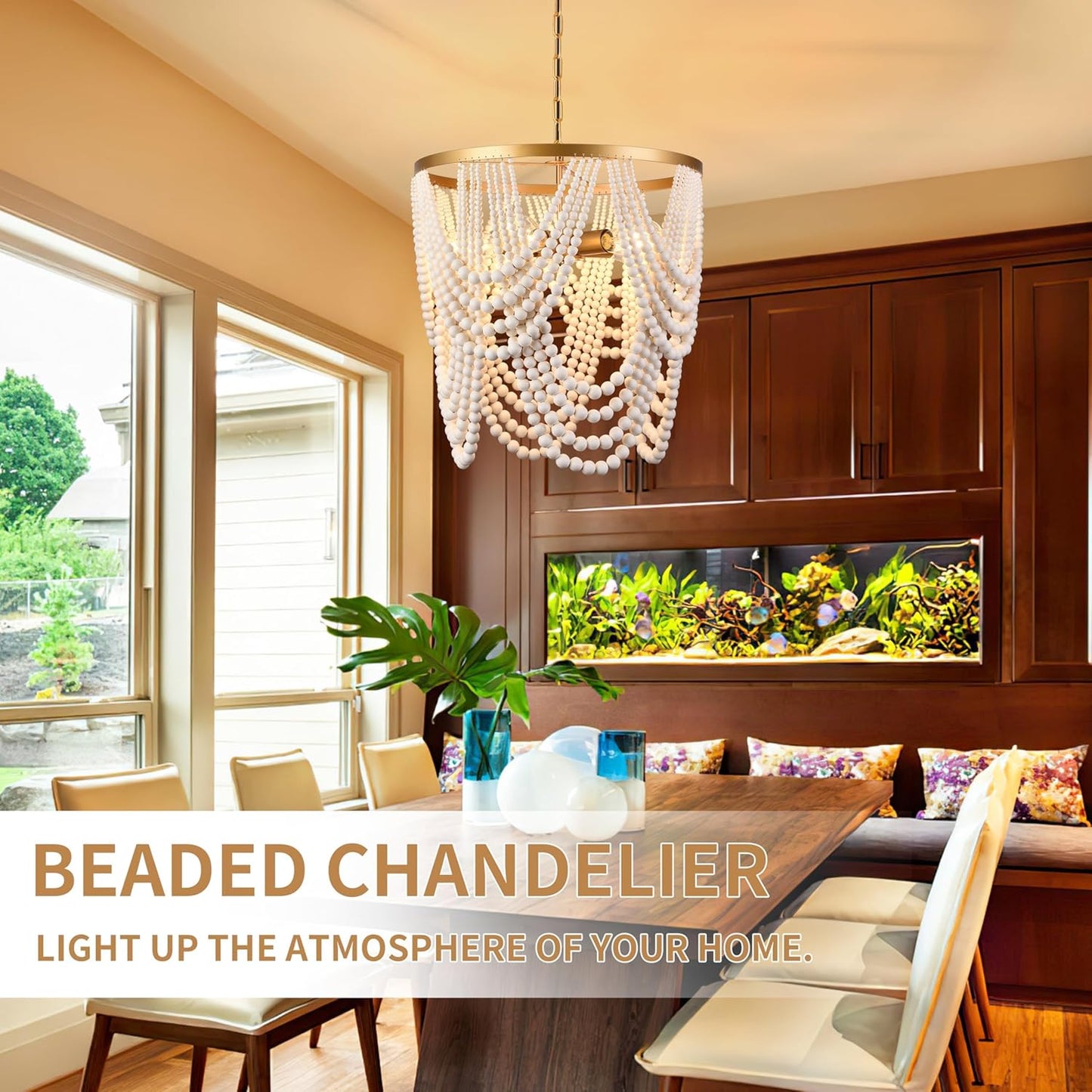 Dining room with a beaded chandelier, wooden cabinets, and an aquarium.