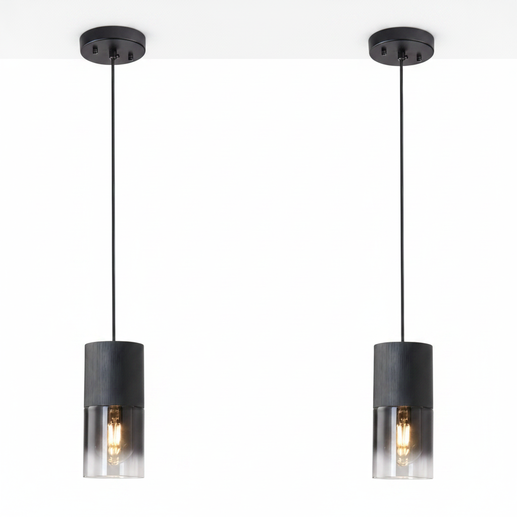 Two black pendant lights with clear glass shades on a white background