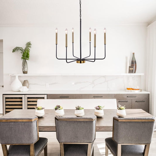 Modern dining room with a chandelier, table, and chairs.