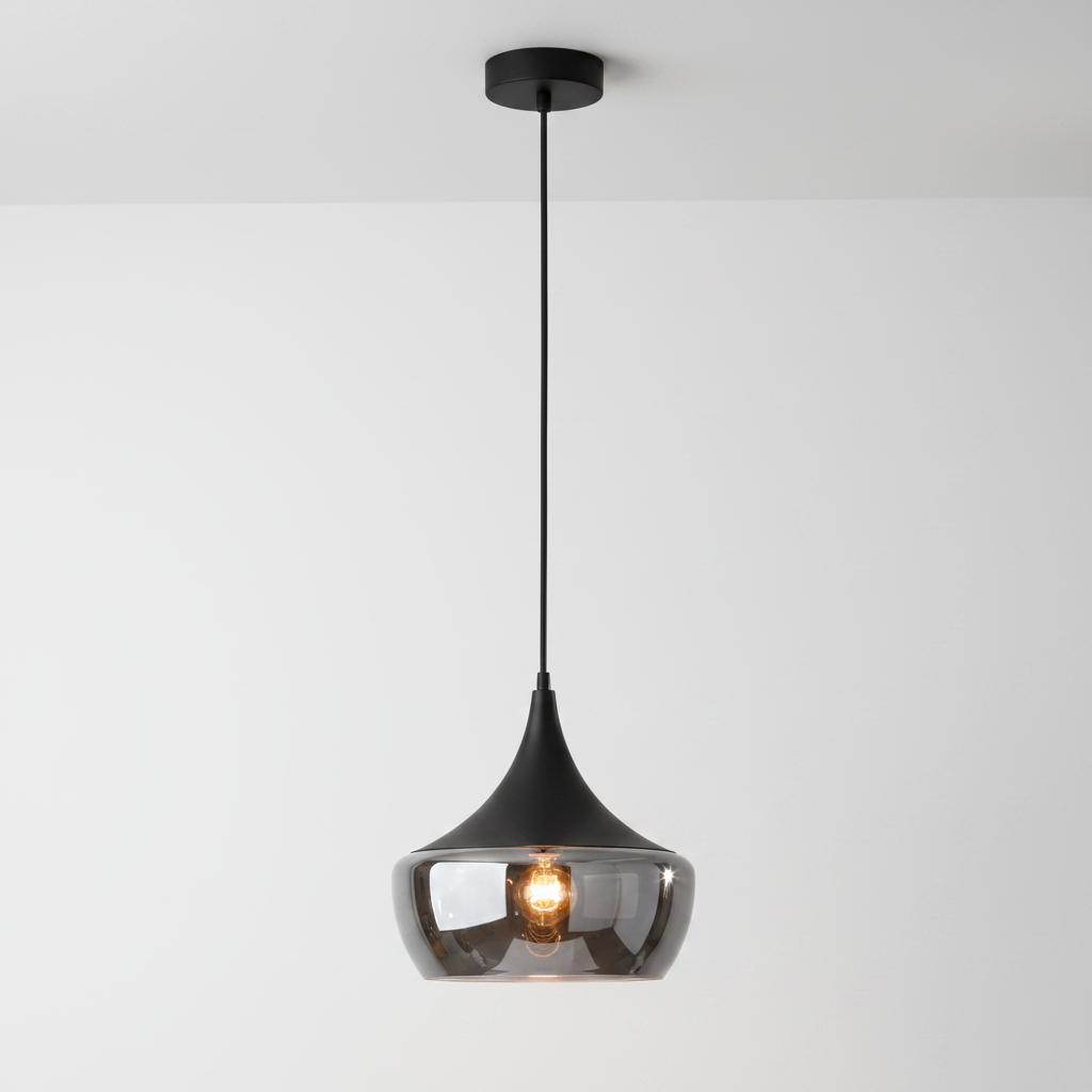 A modern teardrop-shaped pendant light with a glossy black metal frame, a clear smoked glass shade, and a visible warm Edison bulb, suspended against a plain white background.