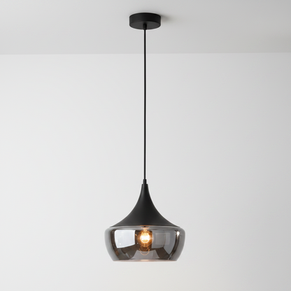 A modern teardrop-shaped pendant light with a glossy black metal frame, a clear smoked glass shade, and a visible warm Edison bulb, suspended against a plain white background.