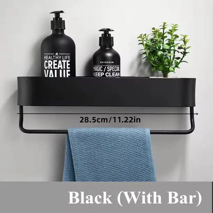 Black towel rack with bottles and a plant on a white background