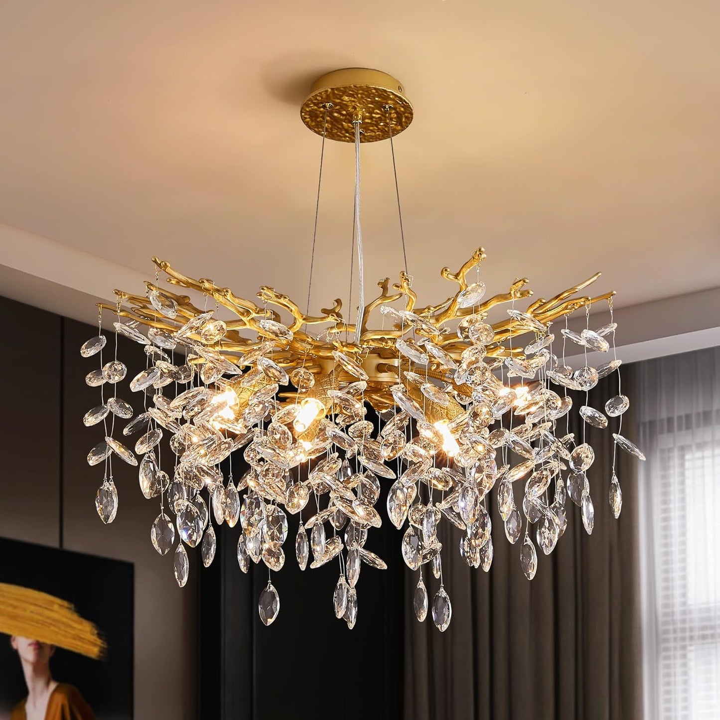 Gold chandelier with crystal accents hanging in a room.