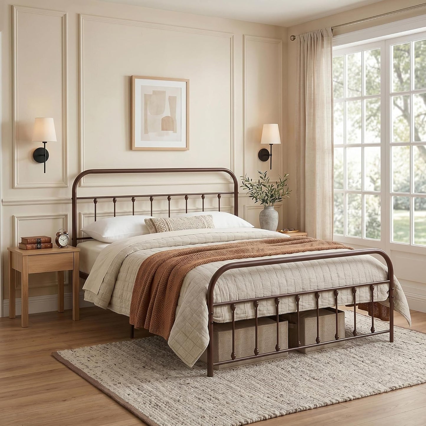 A dark brown metal bed frame with a curved headboard and footboard, styled in a cozy, neutral-toned bedroom with beige walls, a wooden nightstand, and a large window.