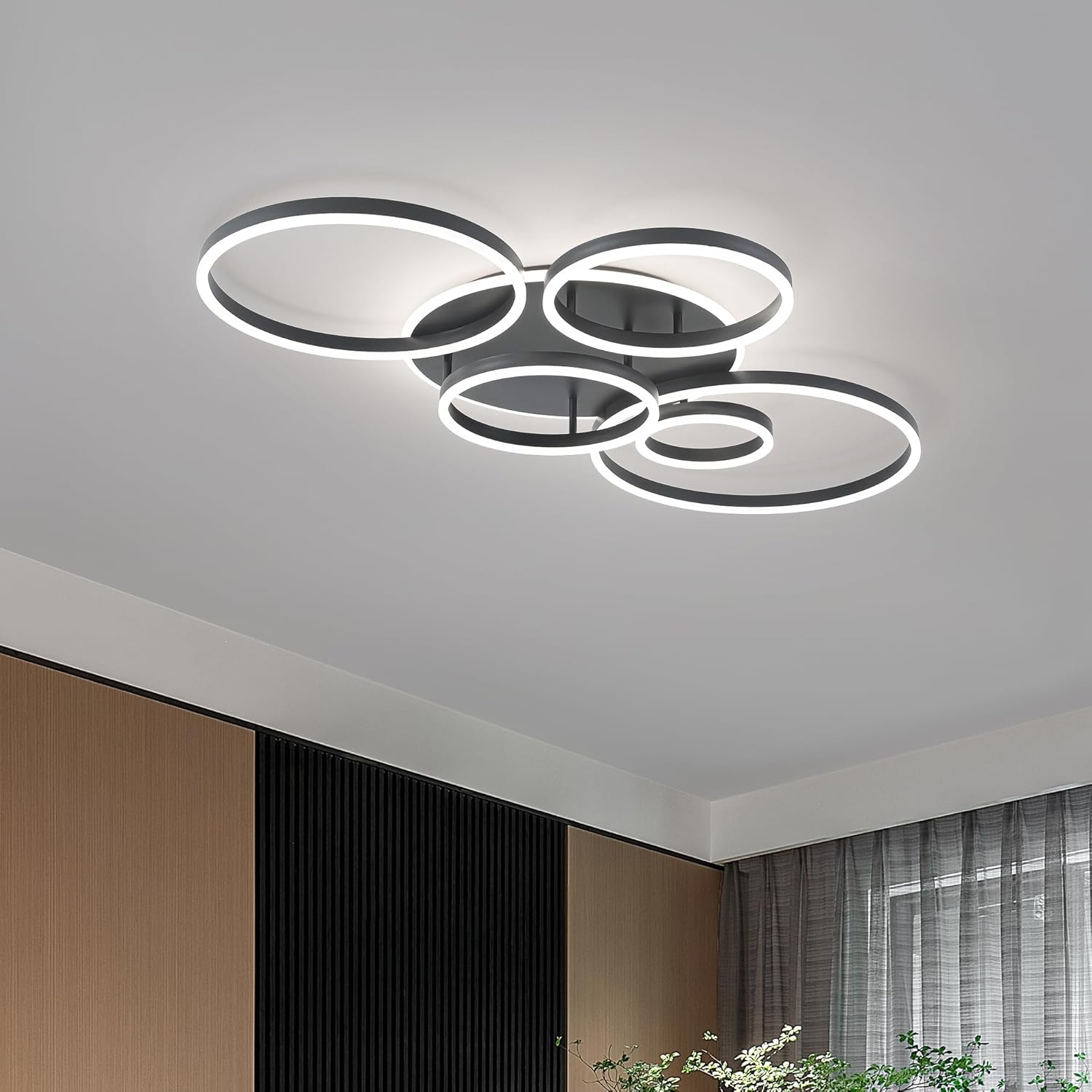 Modern ceiling light fixture in a room with neutral decor
