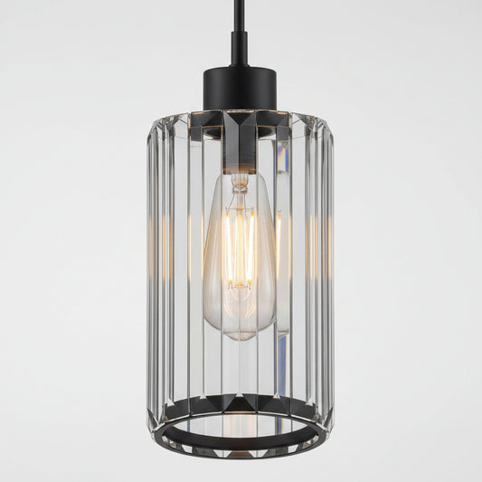 A modern industrial pendant light with a black metal canopy and base, featuring a clear glass cylindrical cage with vertical fluted bars and a glowing warm Edison bulb inside.