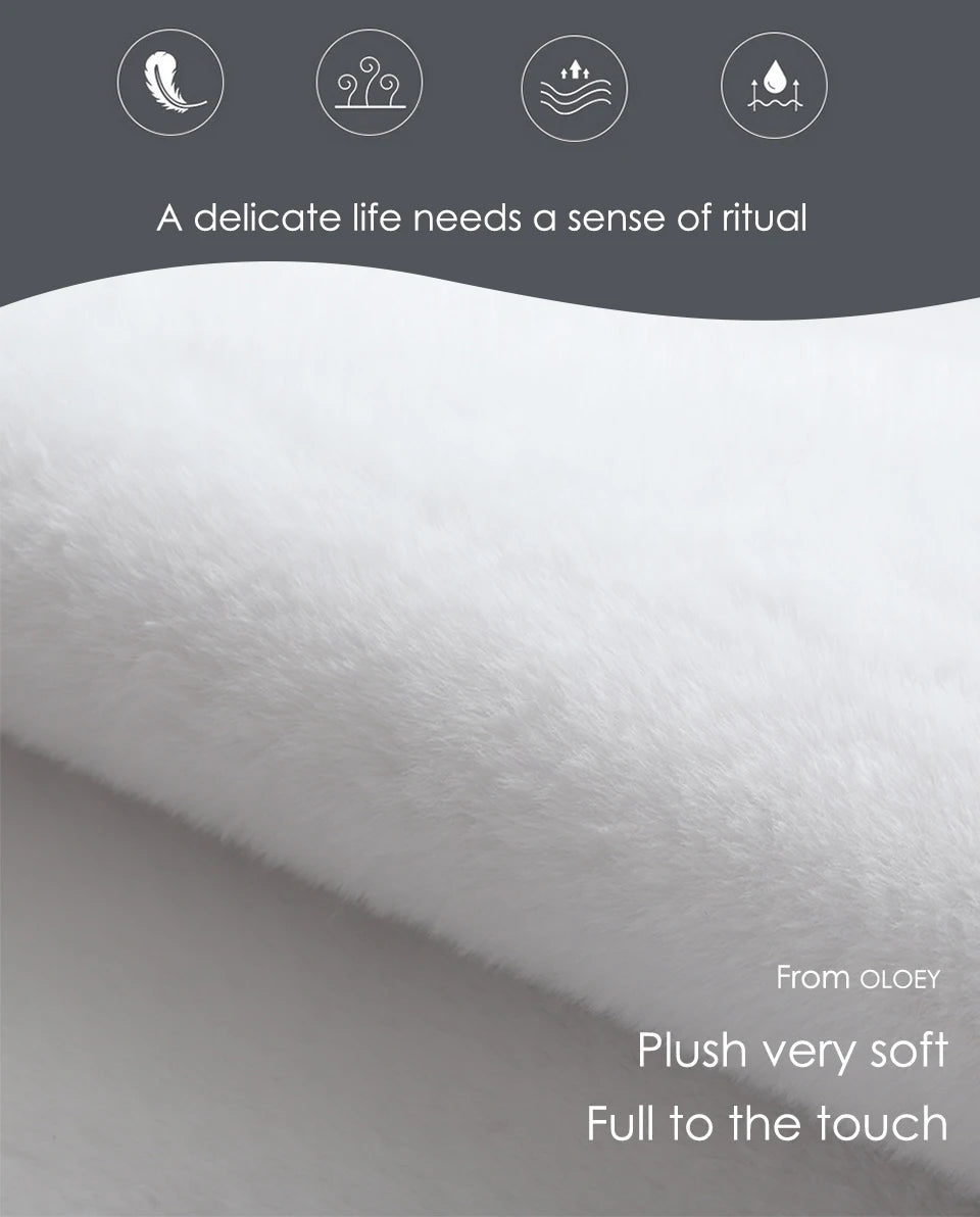 Close-up of plush fabric with Oloey branding and product description text.