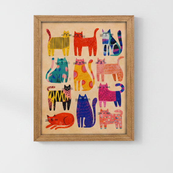 A framed art print featuring a colorful grid of stylized cats in various patterns and colors on a beige background, enclosed in a light wood frame.